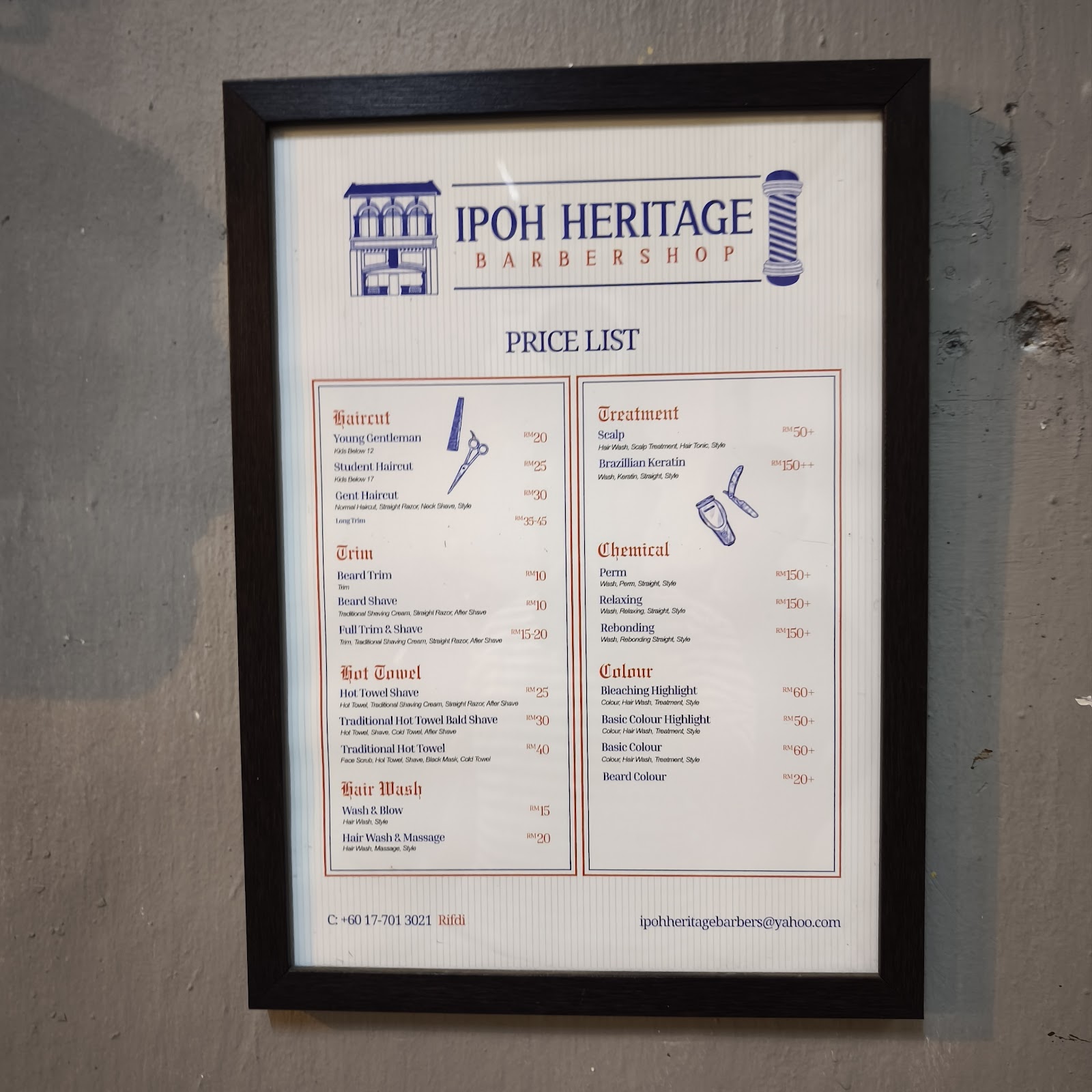 Price list posted at Ipoh Heritage Barber Shop showing haircut, shave, and treatment prices
