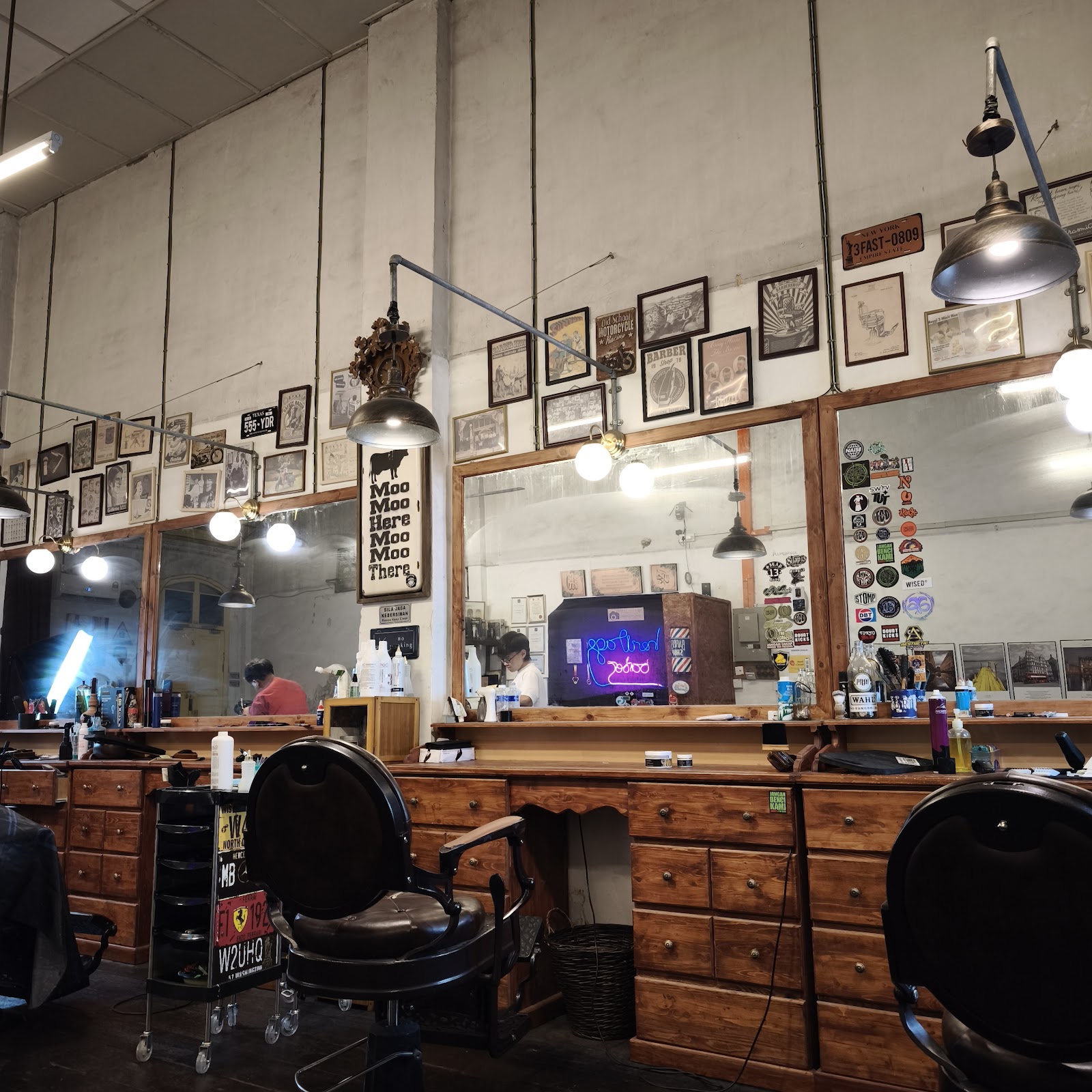 Vintage mirror wall and memorabilia inside Ipoh Heritage Barber Shop