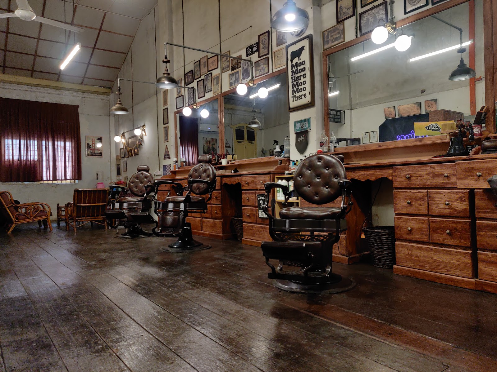 Row of vintage barber chairs inside Ipoh Heritage Barber Shop